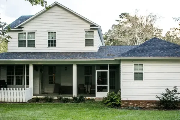 Portfolio-SRC-Back-of-new-construction-farmhouse-white-siding-farmhouse-in-the-suburbs-of-Georgia-2-scaled-v3