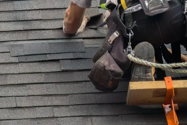Roof-repair-SRC-professional-repair-construction-worker-man-roofer-working-on-roof-maintenance-safety-with-secure-rope-2-scaled-v3
